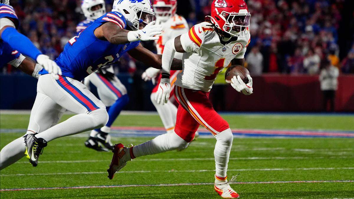 Kansas City Chiefs wide receiver Xavier Worthy (1) runs with the ball after making a catch against the Buffalo Bills during the first half at Highmark Stadium.