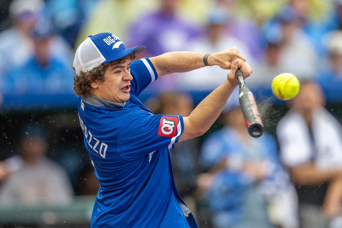 Actor Gaten Matarazzo takes a swing during the Big Slick celebrity softball game at Kauffman Stadium on Friday, May 31, 2024, in Kansas City.
