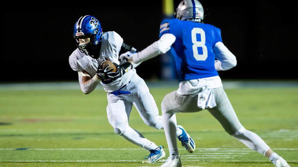 Olathe Northwest’s Max Keller breaks off a run during his team’s 35-33 win over Olathe West in the Kansas high school football playoffs Friday night.