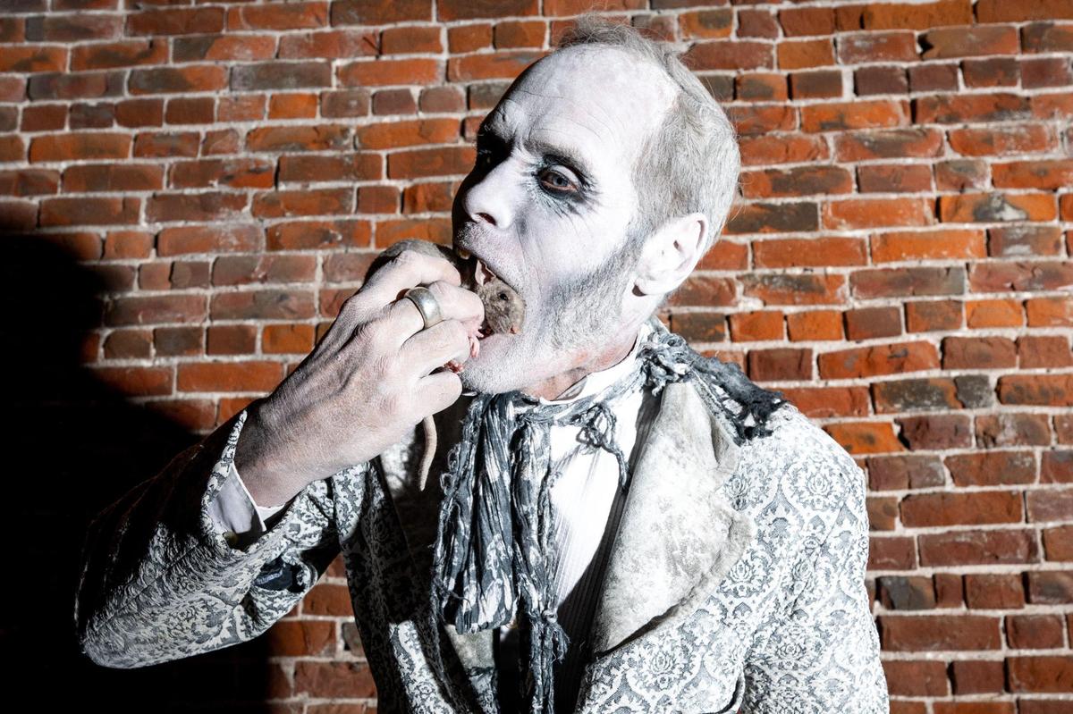 Ratman, who lets live rats crawl in his mouth, is one of the star attractions at the Edge of Hell haunted house.