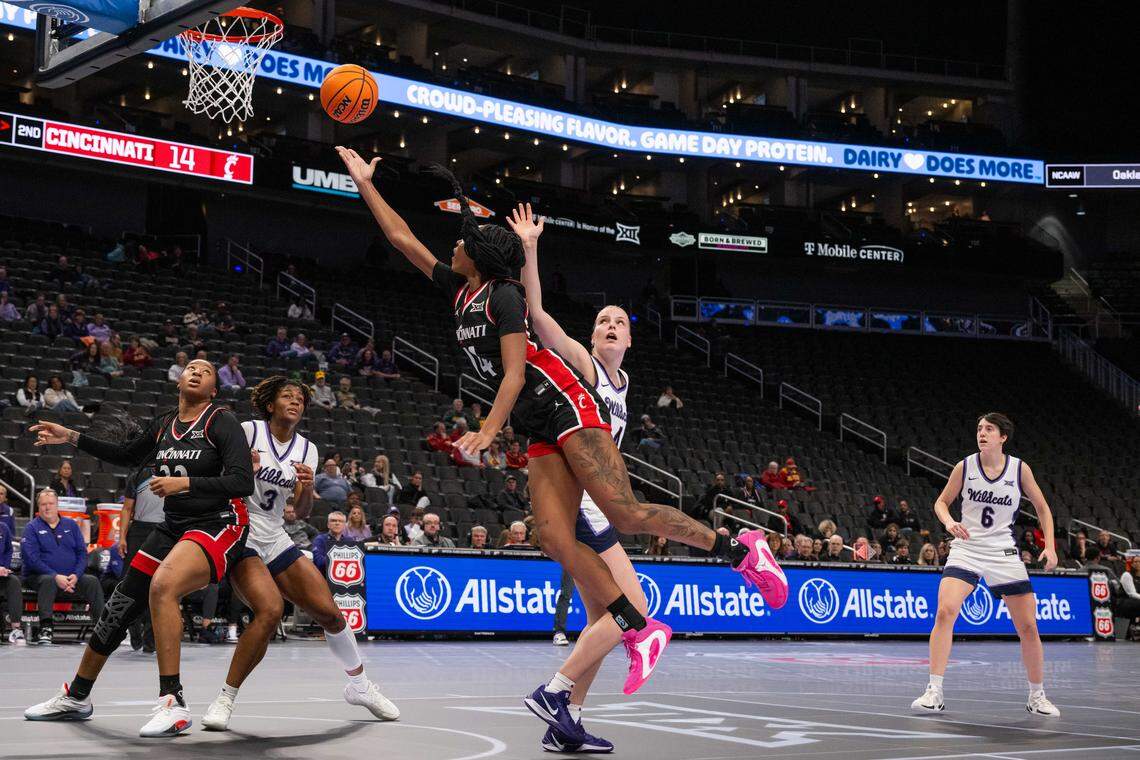 Cincinnati Bearcats forward Ramiyah Byrd (14) shoots a layup over Kansas State forward Nastja Claessens (4) in the first half of the Wildcats’ first-round game vs. the Cincinnati Bearcats in the Big 12 Women’s Basketball Tournament.