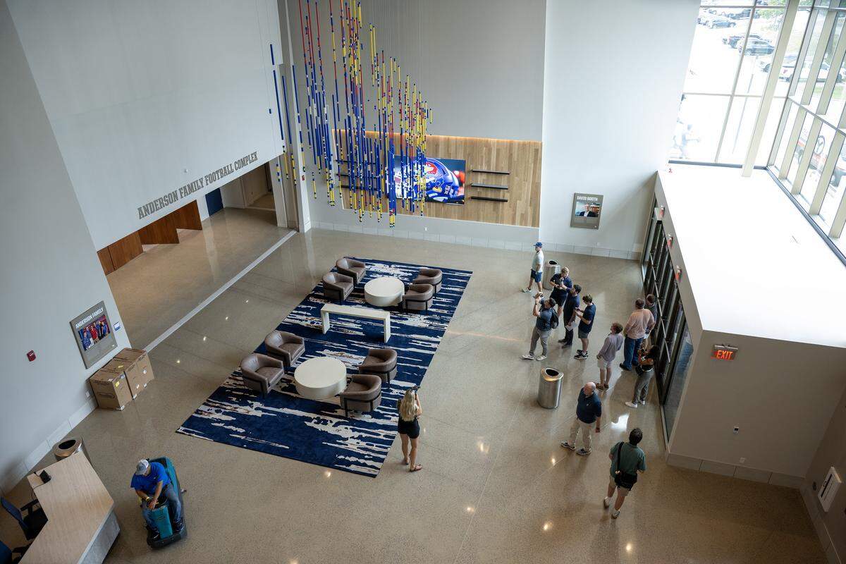 Guests view the Anderson Family Football Complex at the renovated David Booth Kansas Memorial Stadium.