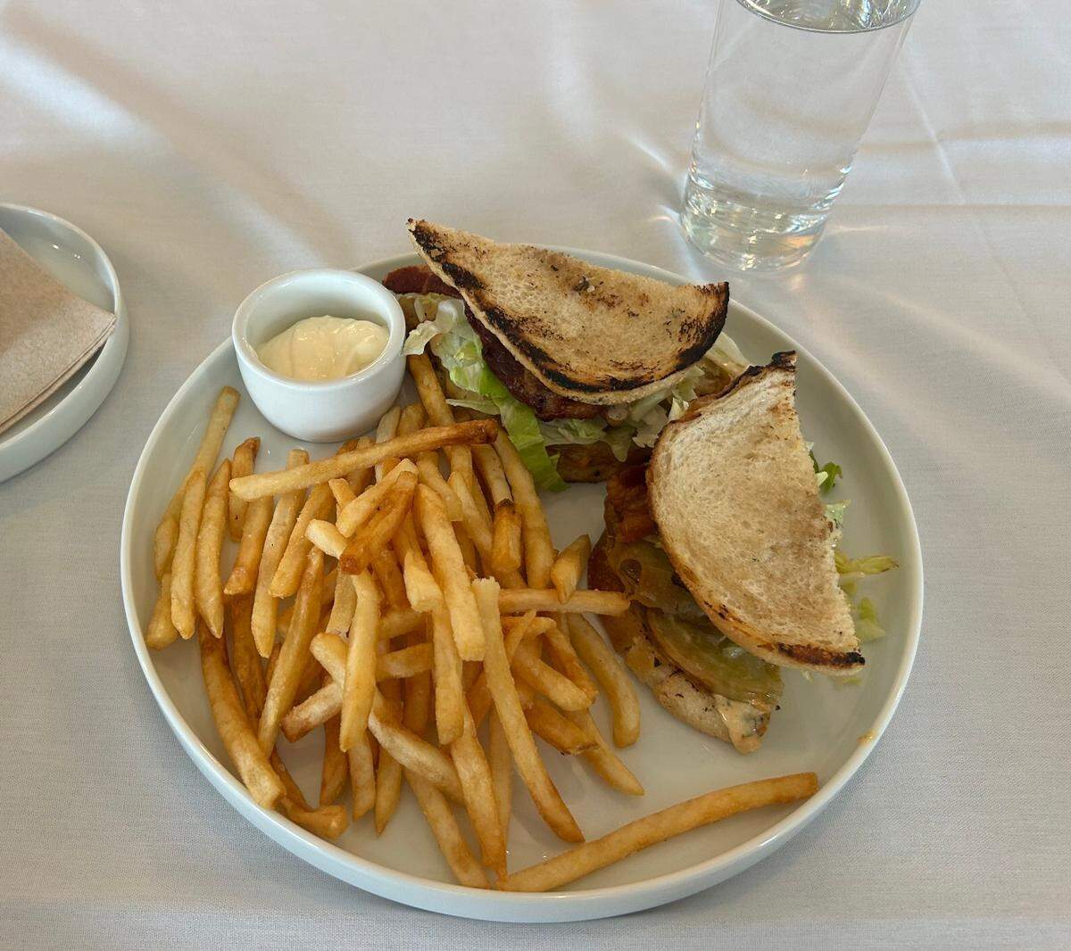 The fried green tomato BLT has fried green tomatoes, bacon, iceberg lettuce, Creole remoulade on sourdough bread.