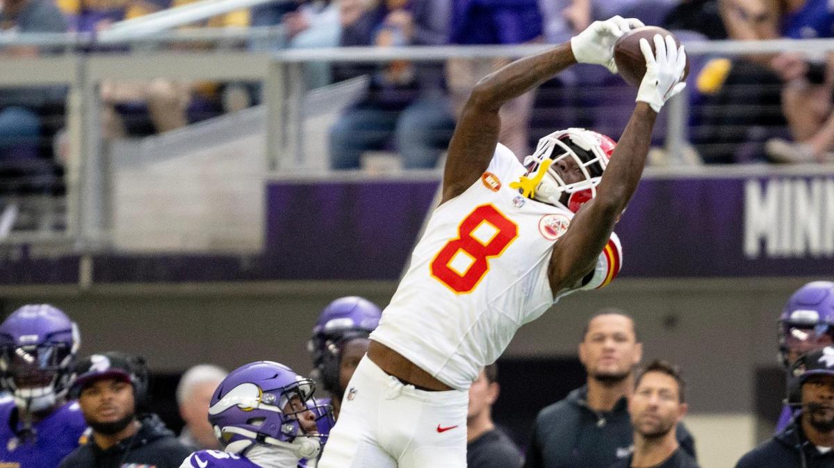 Kansas City Chiefs wide receiver Justyn Ross (8) catches a pass over Minnesota Vikings cornerback Mekhi Blackmon (5) during an NFL football game on Sunday, Oct. 8, 2023, at U.S. Bank Stadium in Minneapolis, Minn.