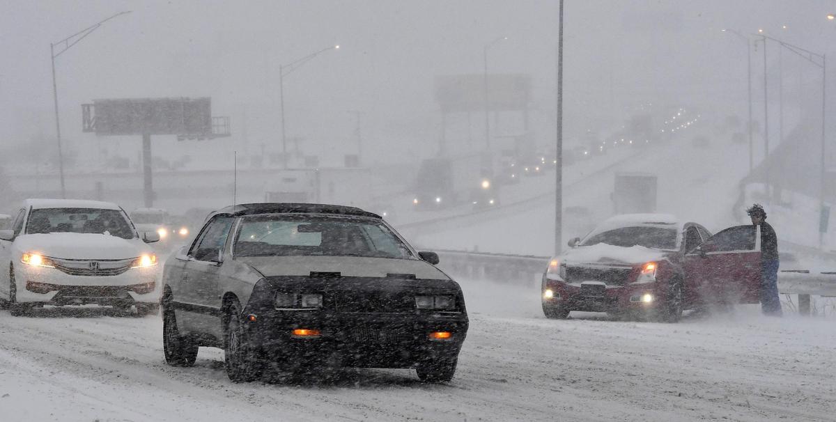Heavy snow and strong winds turned Thursday into driving nightmare for this motorist who ended up stranded into a barrier along I-35 southbound, just south of downtown.