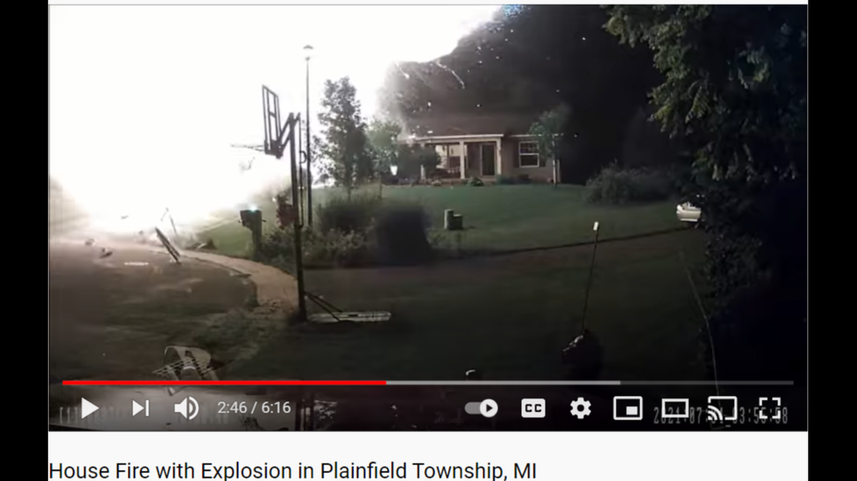 A Plainfield, Michigan firefighter is nearly hit by flaming debris when a propane tank explodes inside a burning home.