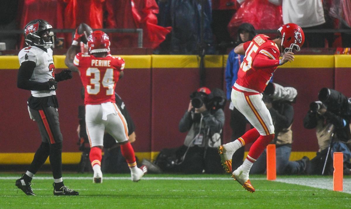 Kansas City Chiefs running back Samaje Perine (34) celebrates after catching a pass for a touchdown while quarterback Patrick Mahomes (15) hobbles injured to the sideline in the fourth quarter against the Tampa Bay Buccaneers on Monday, Nov. 4, 2024, at GEHA Field at Arrowhead Stadium.