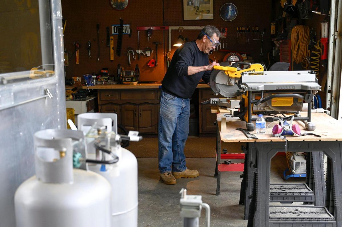 Retired attorney Dale Irwin of Kansas City, working on a 1966 Airstream, keeps busy to keep his brain stimulated. “It really is good for me, you know?”