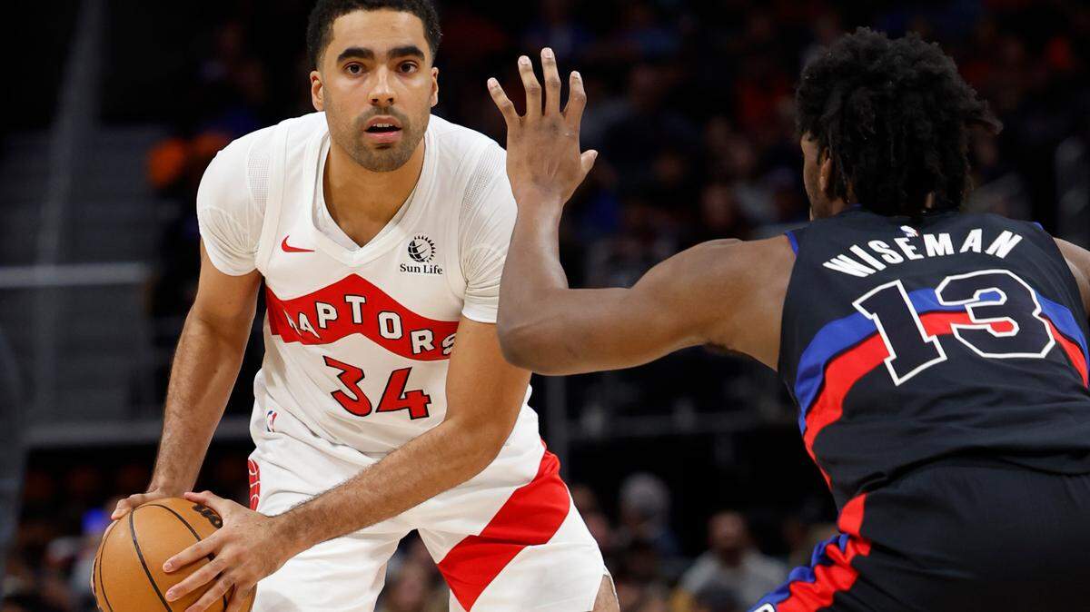 Mar 13, 2024; Detroit, Michigan, USA; Toronto Raptors center Jontay Porter (34) is defended by Detroit Pistons center James Wiseman (13) in the second half at Little Caesars Arena. Mandatory Credit: Rick Osentoski-USA TODAY Sports
