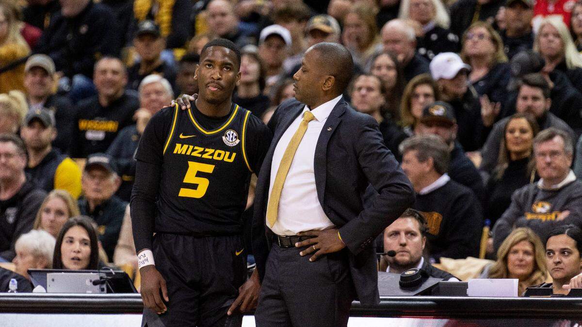 In his first season at Missouri, Tigers men’s basketball coach Dennis Gates, right, is packing the stands at Mizzou Arena. He’s also effusive in his support for other programs, sports and beyond athletics, across campus.