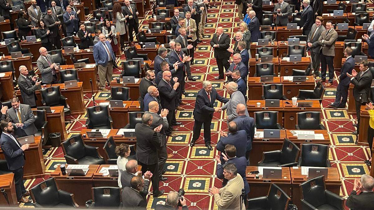 Missouri Gov. Mike Parson shakes hands with state lawmakers ahead of his final State of the State address on Jan. 24, 2024.