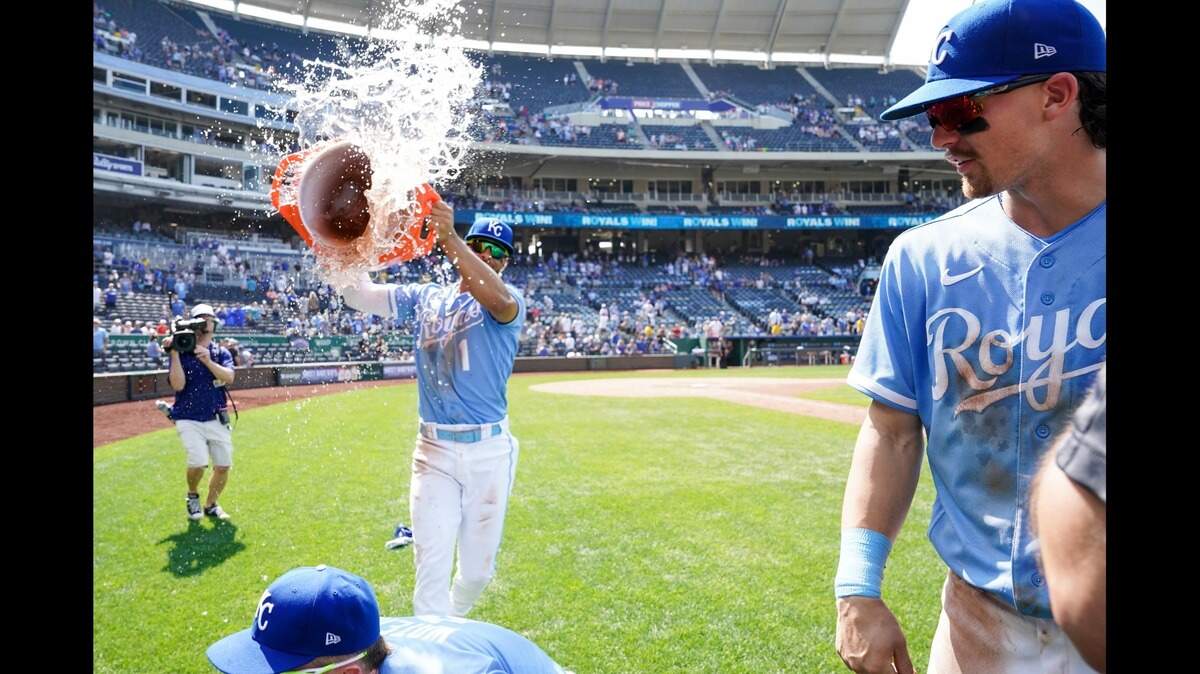 Royals shortstop Bobby Witt Jr., right, is doused by KC teammate MJ Melendez as right fielder Drew Waters (bottom of photo) ducks out of the way following Sunday afternoon’s win against the Tampa Bay Rays at Kauffman Stadium.