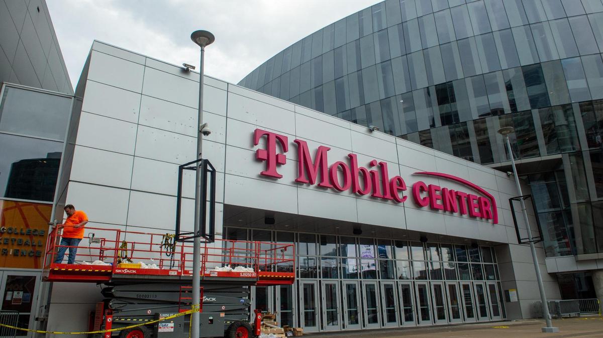 Crews reveal the T-Mobile Center signage at the old Sprint arena on Wednesday morning, July 29, 2020. The Overland Park-based wireless company Sprint merged with T-Mobile earlier this year.