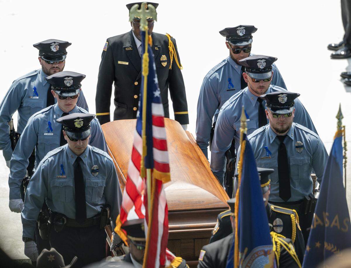 First responders carry Hunter Simoncic's casket out of Children's Mercy Park following the funeral service on Wednesday, Sept. 3, 2025, in Kansas City, Kansas. Simoncic was killed Aug. 26 after being struck by a fleeing driver while deploying stop sticks.