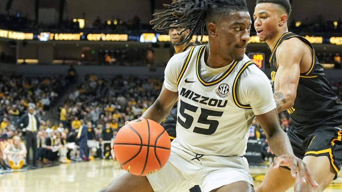 Missouri Tigers guard Sean East II, left, dribbles around Wichita State Shockers guard Xavier Bell during Sunday afternoon’s game Mizzou Arena.