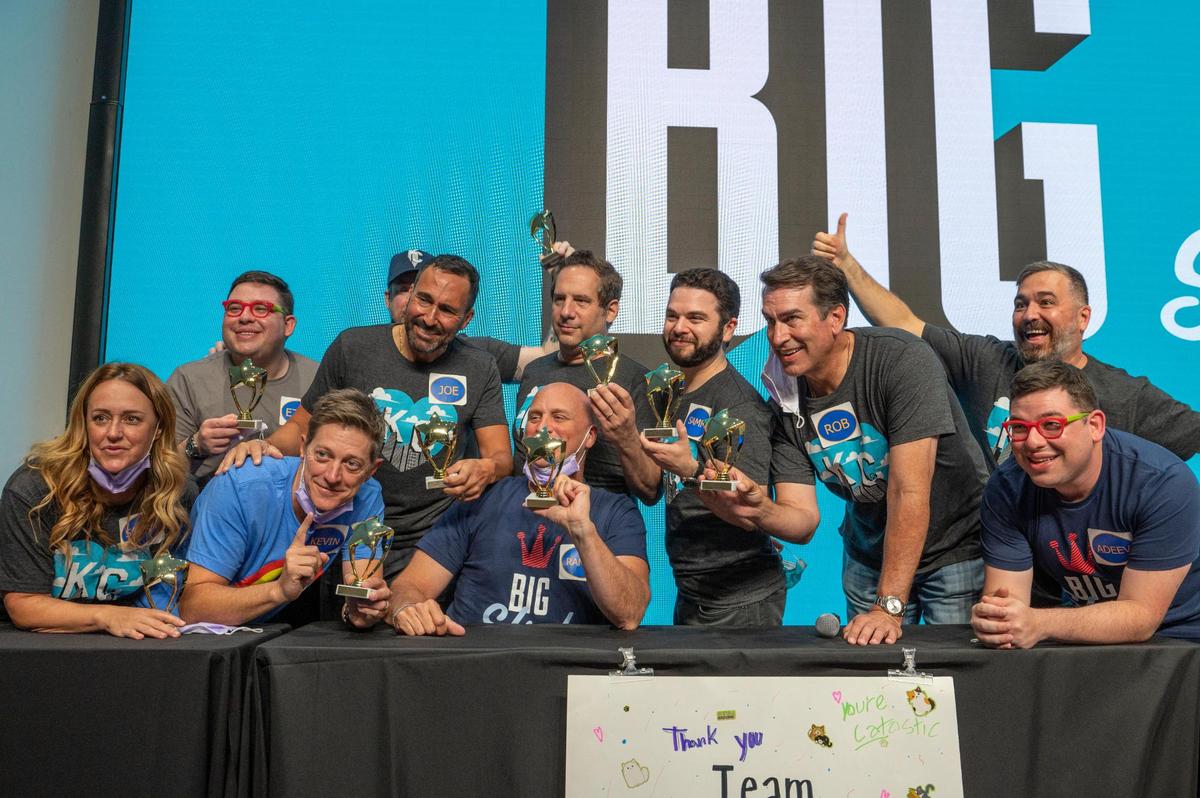 Big Slick Celebrity Weekend host Rob Riggle, third from right, and his team celebrated their win in a “Friendly Feud” match after a press conference at Children’s Mercy Hospital on Friday.