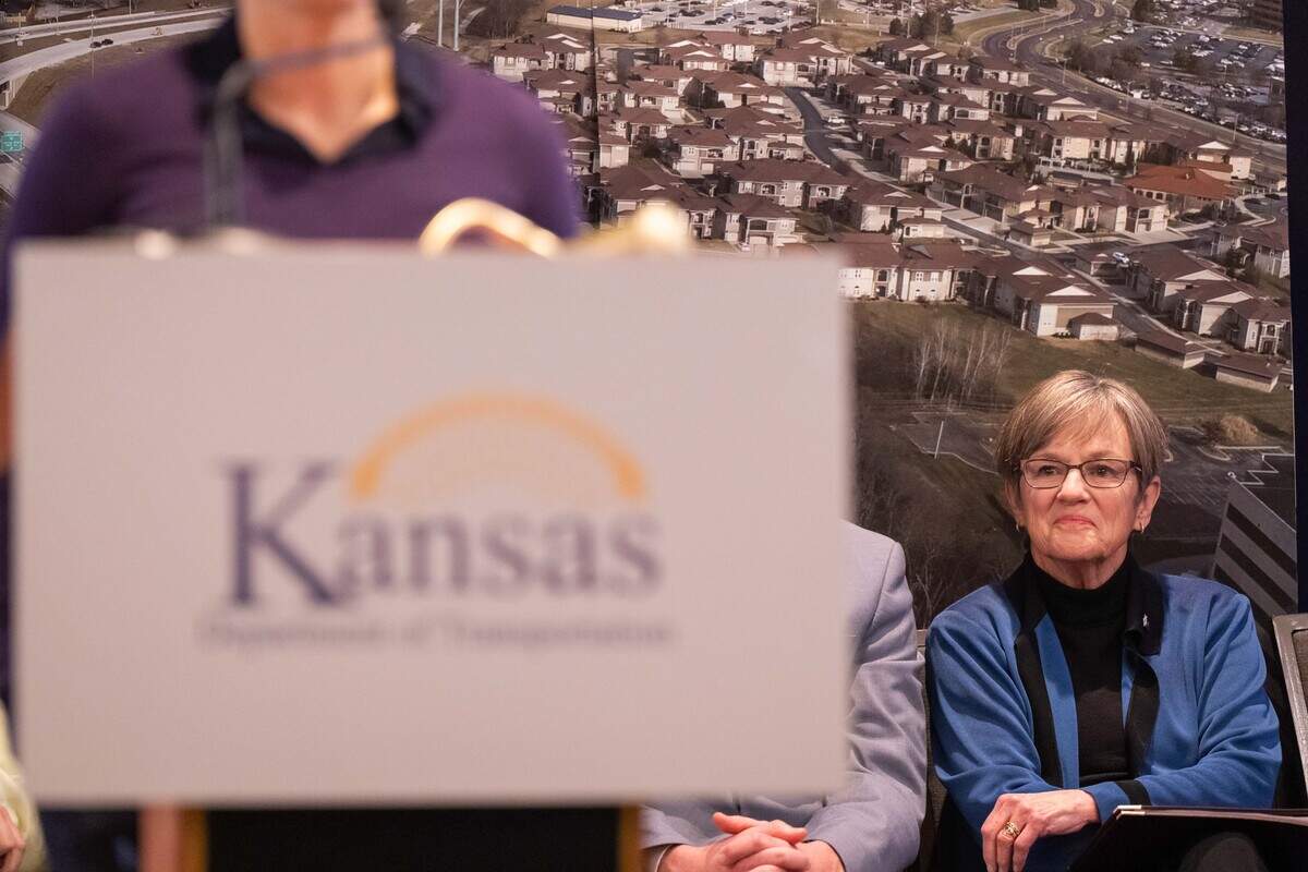 Kansas Gov. Laura Kelly listens as Kansas Rep. Sharice Davids speaks at the ribbon cutting ceremony for the opening of new US-69 Highway Express Lane, on Tuesday, February 17, 2026, in Overland Park.