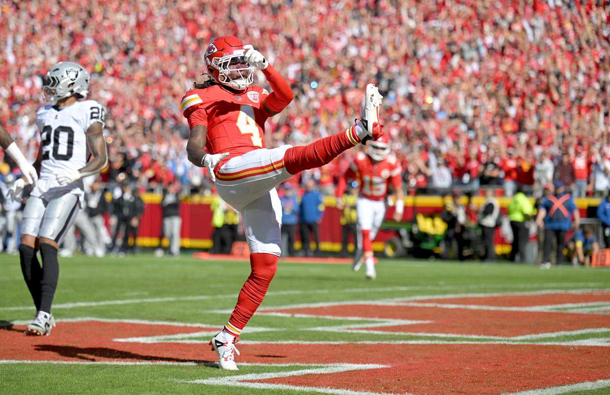 Chiefs wide receiver Rashee Rice kicks the ball into the stands in celebration  after scoring a touchdown against the Las Vegas Raiders during an NFL Week 7 game at GEHA Field at Arrowhead Stadium in Kansas City on Sunday, Oct. 19, 2025.
