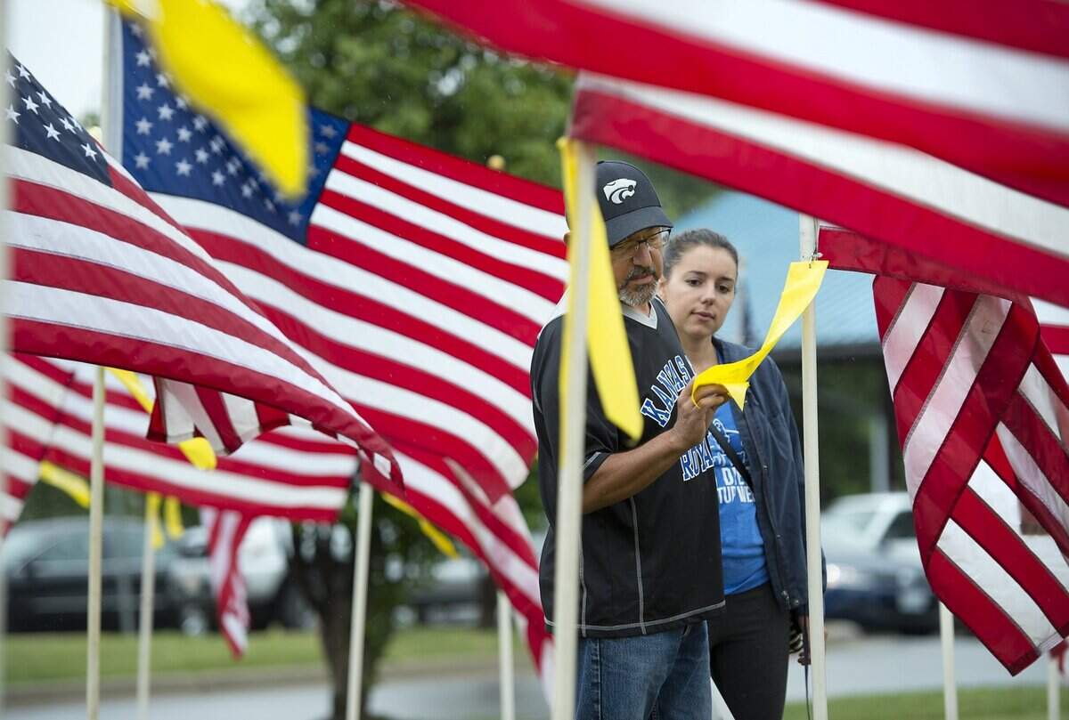 Flags for Freedom will run June 26 through July 10 in downtown Merriam. In 2016, Michael Wallis of Shawnee and his daughter, Justine Nelson of San Diego, visited the display.