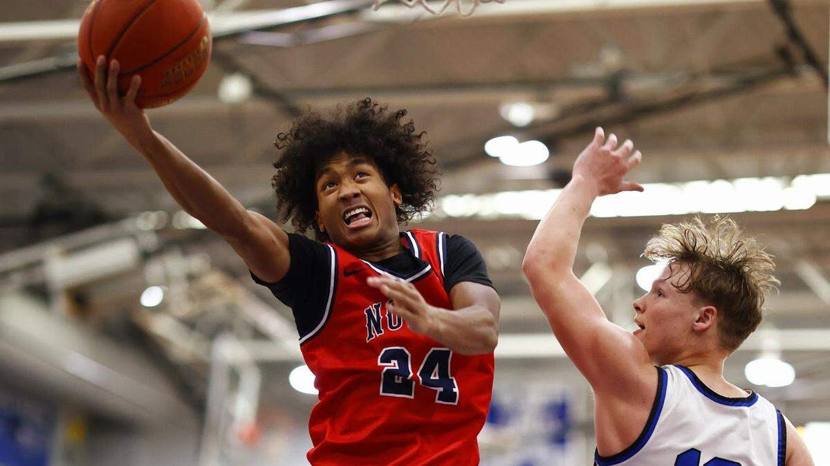 Olathe North junior Jaalan Watson drives for two of his team-high 17 points in a 69-58 win on Friday night.