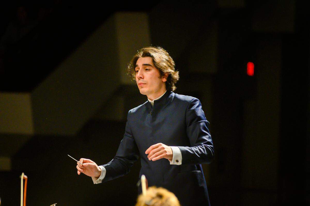 Symphony performance 7:30 pm with Shah (Shokhrukh) Sadikov conducting Saturday 9 Feb 2019, here with his second piece, third in the program, “Pictures at an Exhibtion” by Modest Mussorgsky. Photo, copyright 2019 Mike Strong with full usage permissions to Shah and the Symphony.