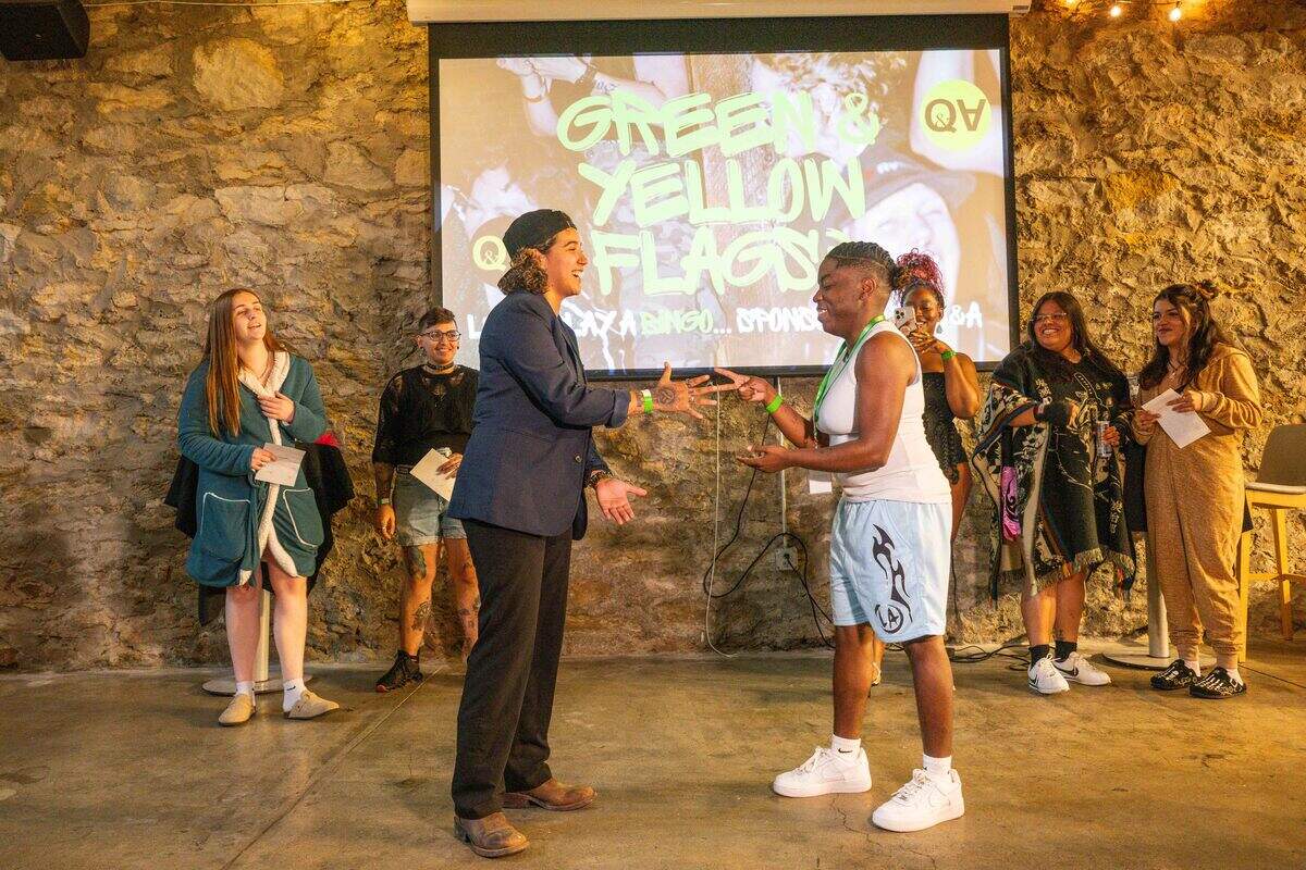 Two singles perform ‘rock, paper, scissors’ at “Where To Find Us”, during the game portion of the evening.