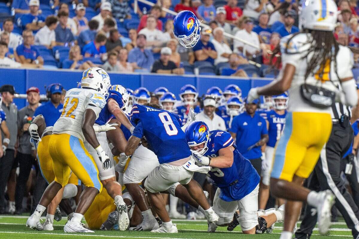 Kansas Jayhawks quarterback Isaiah Marshall (8) loses his helmet after being tackled in the second half of the Jayhawks game vs. Long Island University Sharks at David Booth Memorial Stadium on Friday, September 4, 2026, in Lawrence.