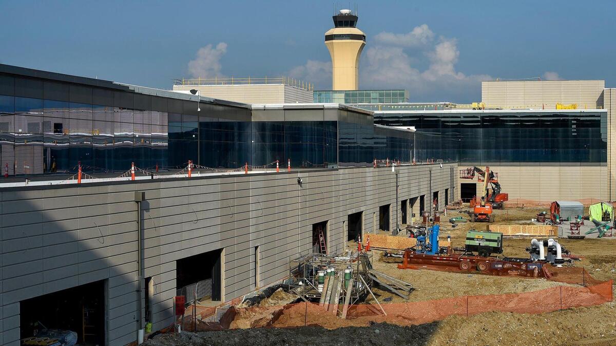 Kansas City International Airport’s new terminal building features a 635-foot concourse connector, left, between the two sections of the building.