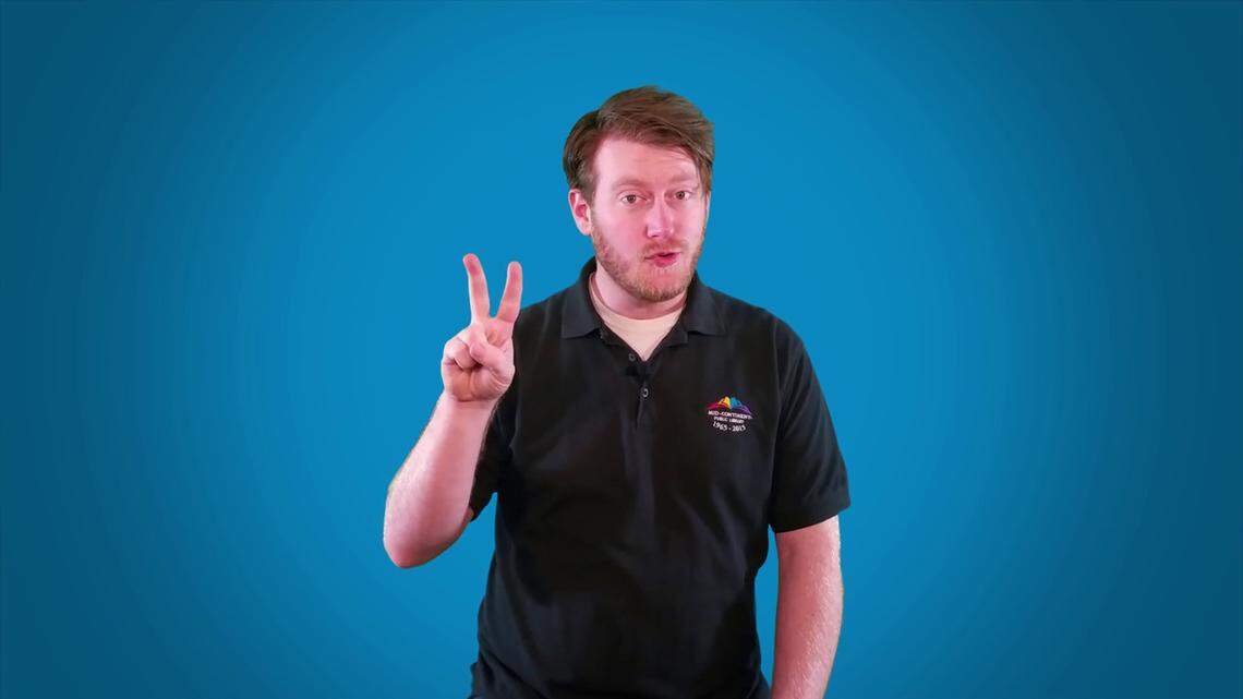 Andrew McKinley works with the Mid-Century Library to make a YouTube video. The library will regularly add videos of library staff reading, doing finger plays or singing.