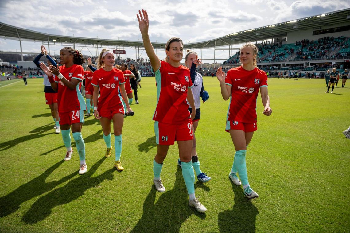 Members of the Kansas City Current celebrated after they defeated the Portland Thorns, 5-4, in the home opener at the new CPKC Stadium on Saturday, March 16, 2024, in Kansas City.