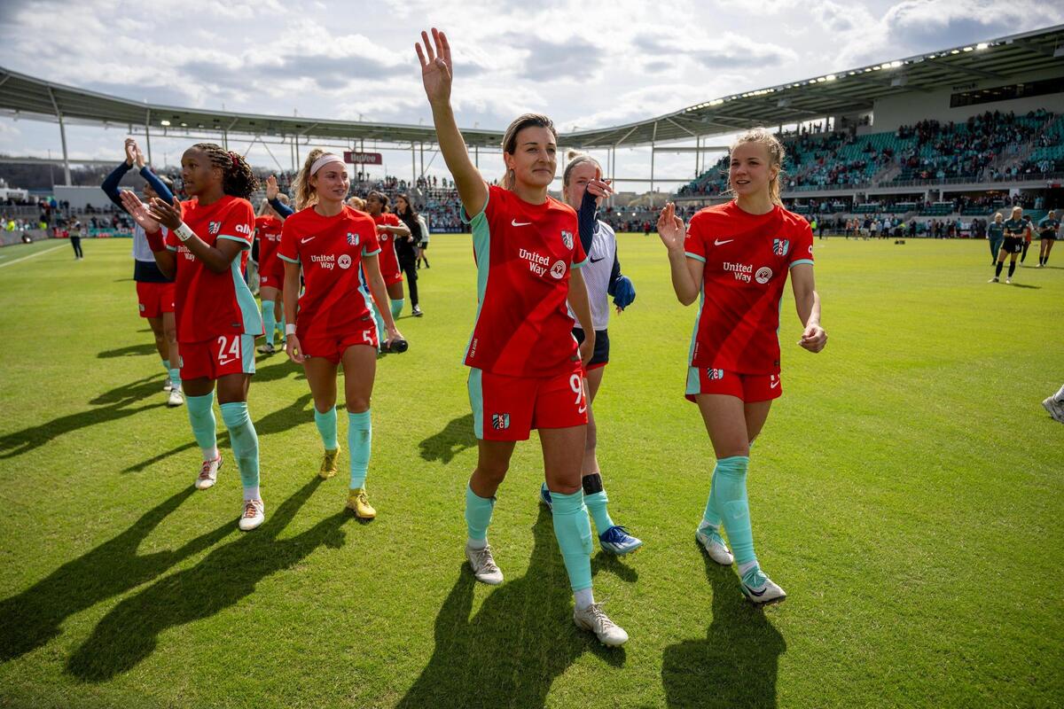 Members of the Kansas City Current celebrated after they defeated the Portland Thorns, 5-4, in the home opener at the new CPKC Stadium on Saturday, March 16, 2024, in Kansas City.