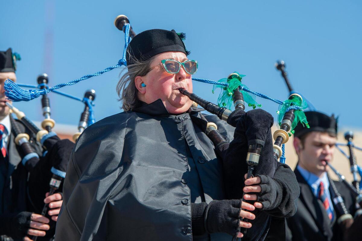 A member from St. Andrews Pipes and Drums plays the bag pipe during the Kansas City St. Patrick’s Day parade on Friday, March 17, 2023, in Kansas City.
