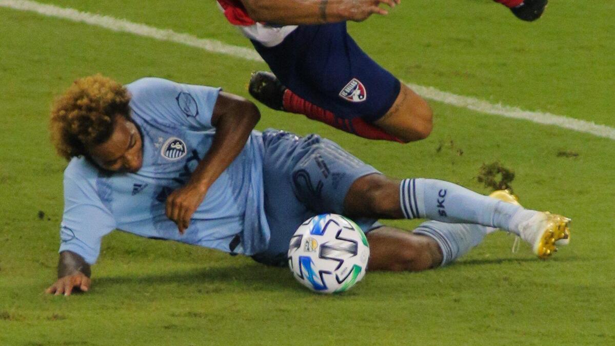 Gianluca Busio of Sporting Kansas City wins a challenge against Franco Jara of FC Dallas in Wednesday night’s match at Children’s Mercy Park. Sporting KC drew even before halftime, but could not find a winner in the second half as the game ended 1-1.