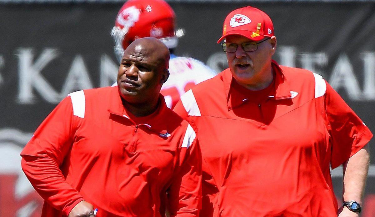 Offensive coordinator Eric Bieniemy and head coach Andy Reid observe players on the first day of the Kansas City Chiefs’ rookie minicamp earlier this month in Kansas City.