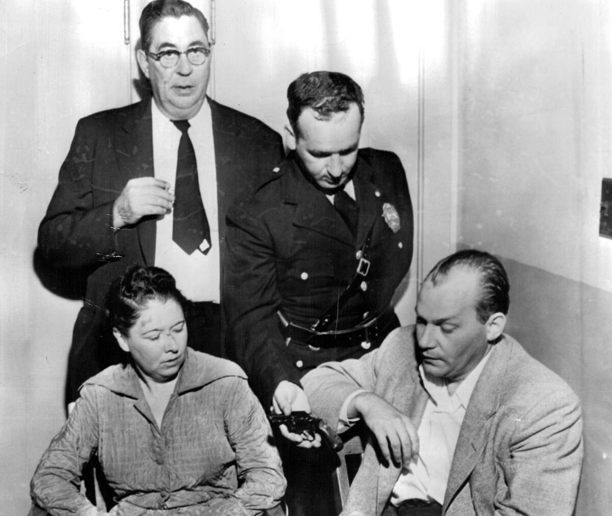 Bonnie Heady and Austin Hall with the arresting officers Lt. Louis Shoulders (top left) and uniformed patrolmen Elmer Dolan