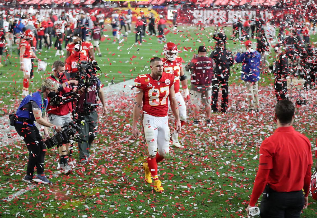 Kansas City Chiefs tight end Travis Kelce walks off the field through the confetti being showered on the field for the Tampa Bay Buccaneers victory Sunday, February 7, 2021, at Super Bowl LV at Raymond James Stadium in Tampa, Florida.