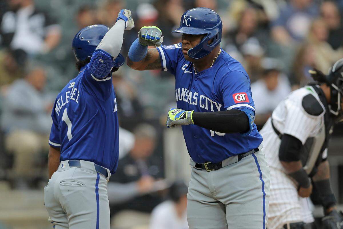Kansas City Royals catcher Salvador Perez (13) celebrates with teammate MJ Melendez (1) after hitting a two-run home run in the eight inning during game one of a double header against the Chicago White Sox at Guaranteed Rate Field on Apr 17, 2024 in Chicago, Illinois, USA.