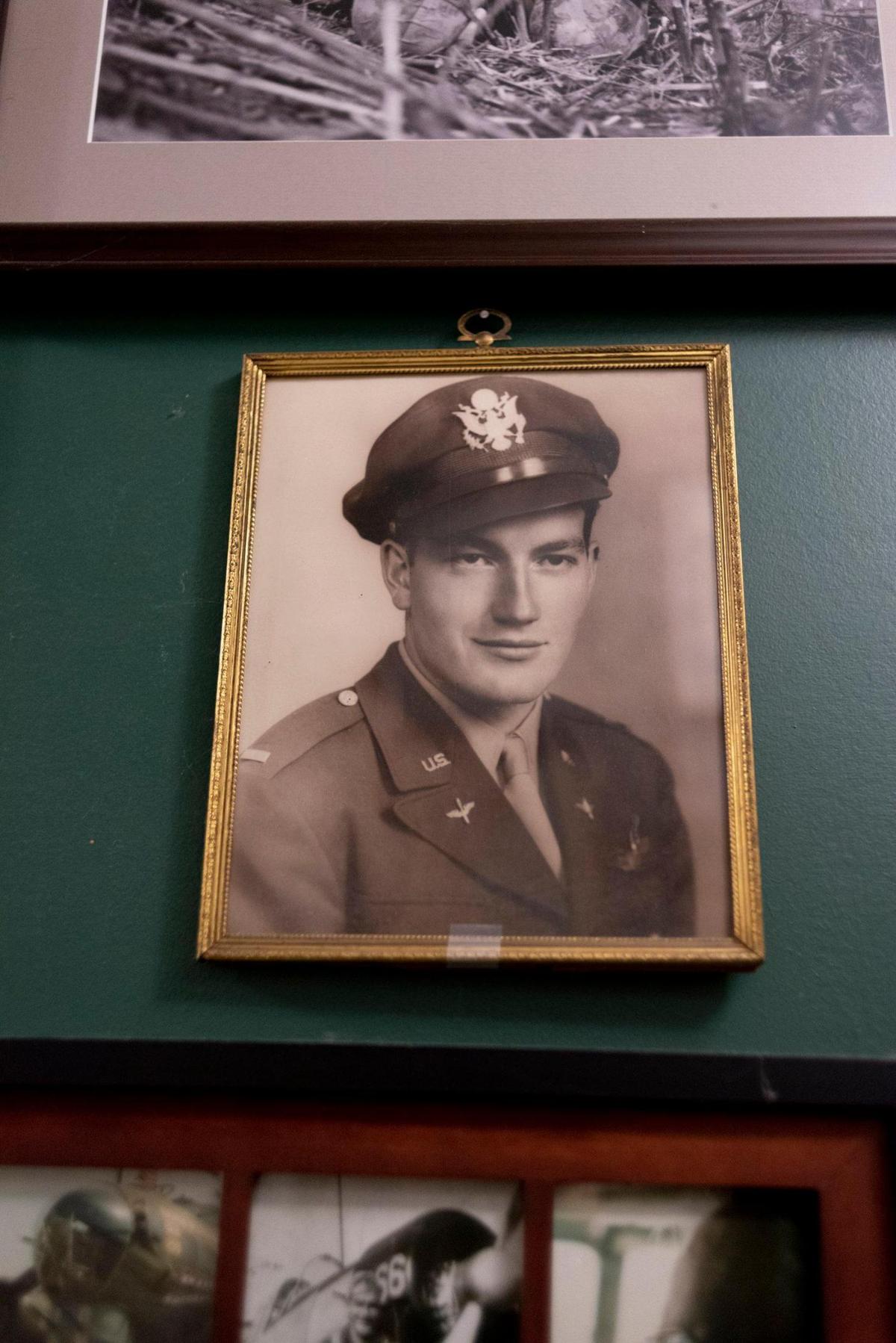 In his home, John Musgrave keeps a portrait of his father, Robert Musgrave, a pilot in World War II.