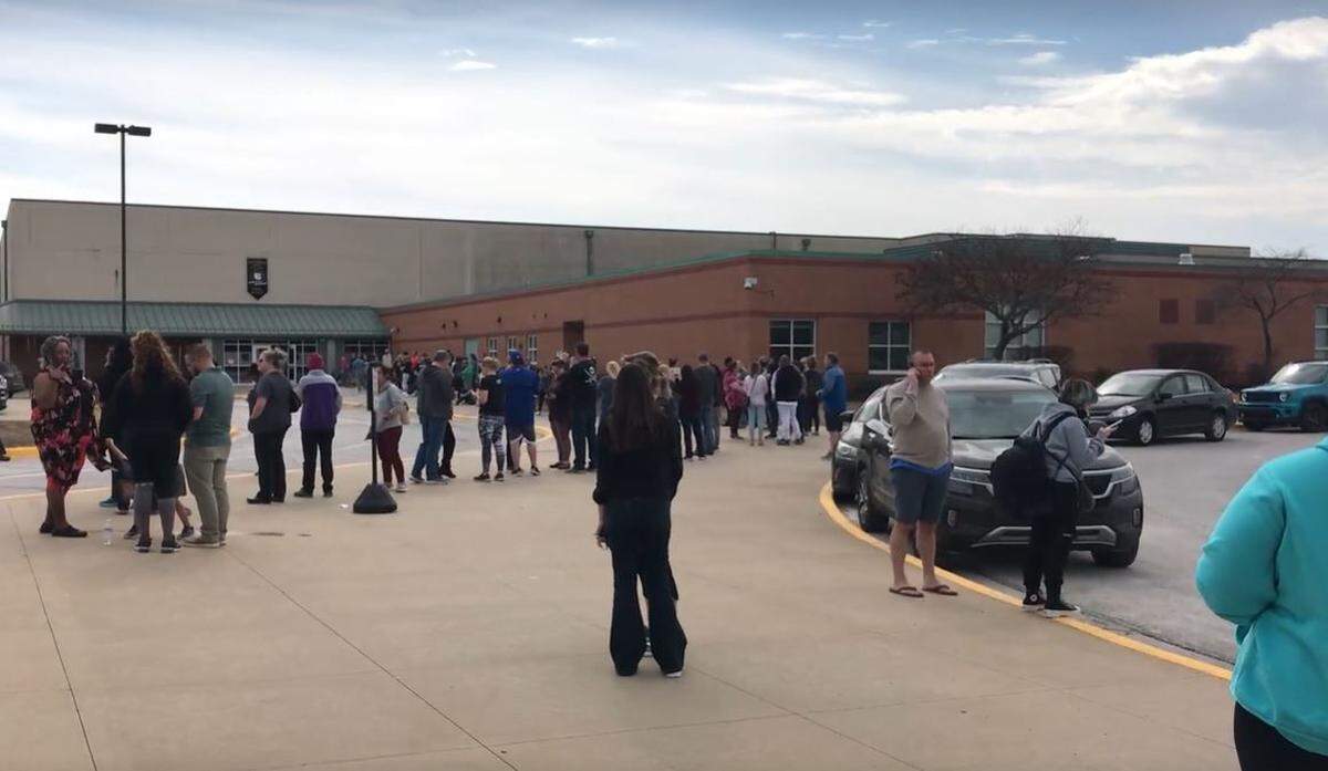 Parents of Olathe East High School students waited at California Trail Middle School to reunite with their children on Friday. A shooting at the high school injured an administrator and a school resource officer. 