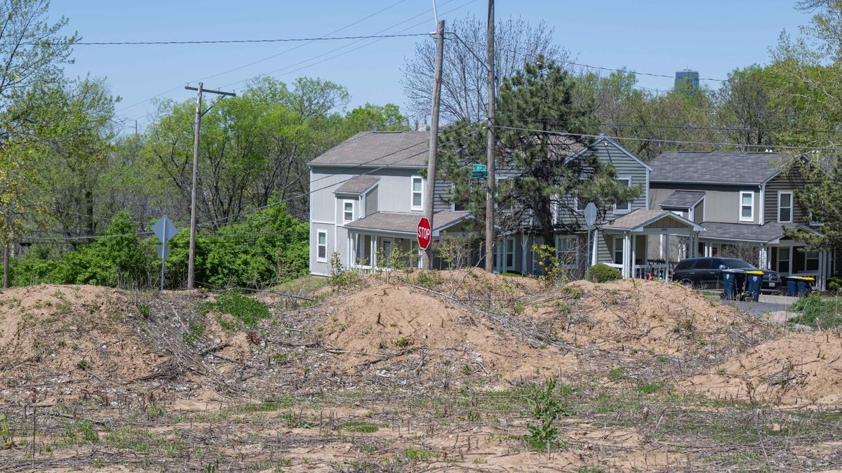 An empty lot of a failed housing development littered with trash in the 2500 block of Michigan Avenue