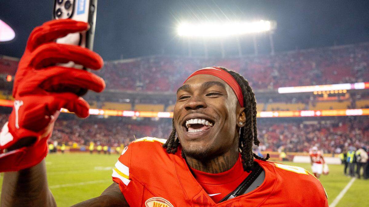 Kansas City Chiefs wide receiver Rashee Rice (4) records a video after the Chiefs defeated the Cincinnati Bengals 25-17 in an NFL football game at GEHA Field at Arrowhead Stadium on Sunday, Dec. 31, 2023, in Kansas City.