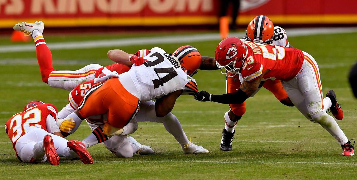 The Chiefs’ Tyrann Mathieu, left, Frank Clark, Dan Sorensen and Anthony Hitchens bring down Browns running back Nick Chubb during the second half of Sunday’s game at Arrowhead.