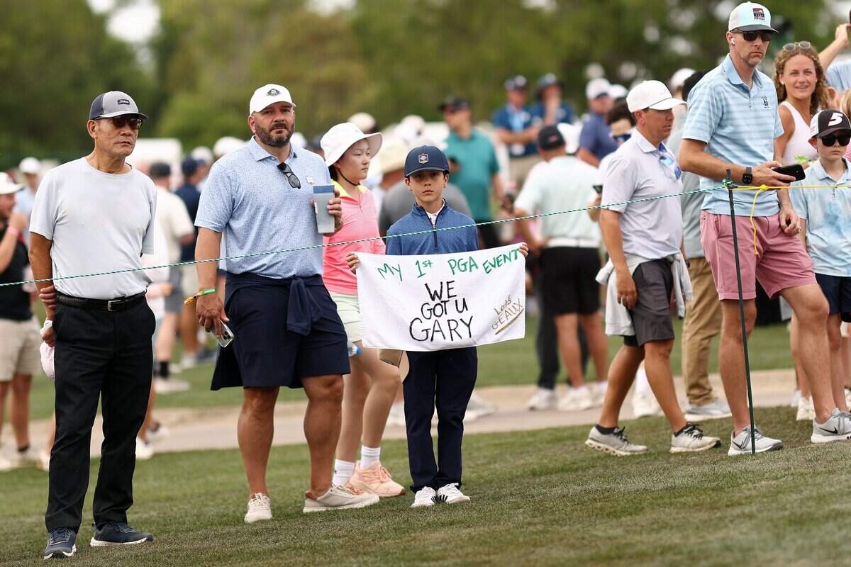 A fan holds a sign in support of golfer Gary Woodland during Round 3 of the Texas Children’s Houston Open at Memorial Park Golf Course in Houston on March 28, 2026.