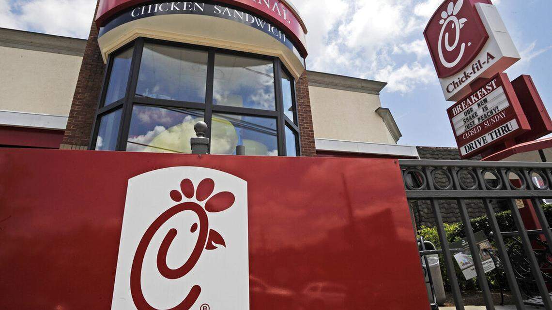 A group of women upset over Chick-fil-A’s COVID-19 protocols are accused of hurling bricks at the drive-thru window of a restaurant in Atlanta, police say. (AP Photo/Mike Stewart, File)