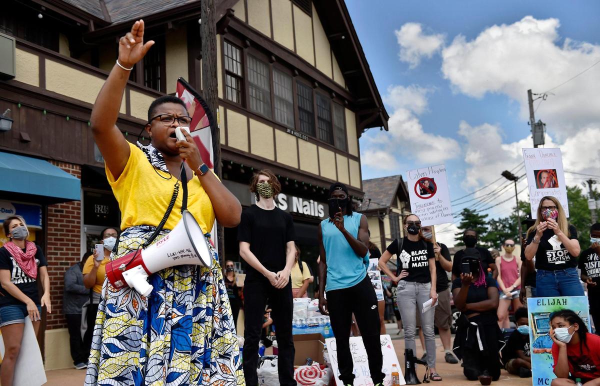 Attorney Stacy Shaw speaks to about 100 people gathered at Brookside Boulevard and E. 63rd Street in Kansas City to denounce systemic racism in a protest titled â€œBrookside Black Lives Matter Brigade - We Must All Come Together,â€ Sunday, Aug. 2, 2020. Following speeches and singing, they marched east on 63rd Street to Troost Avenue.