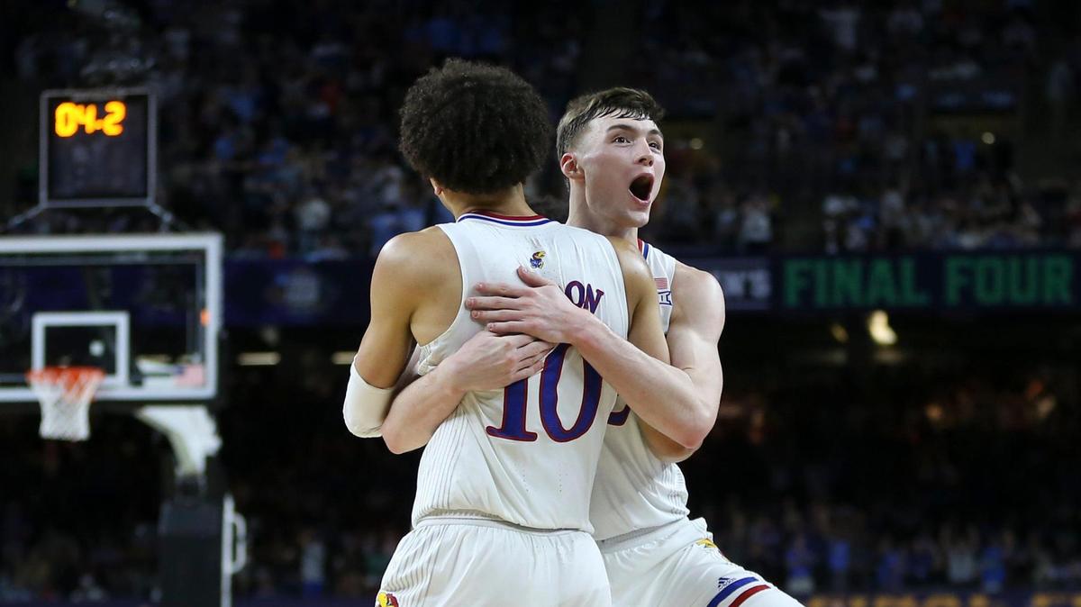 Kansas’ Christian Braun and Jalen Wilson celebrate after North Carolina turned the ball over late in the second half of the national championship game at the Superdome in New Orleans on Monday night. Kansas went on to win 72-69.