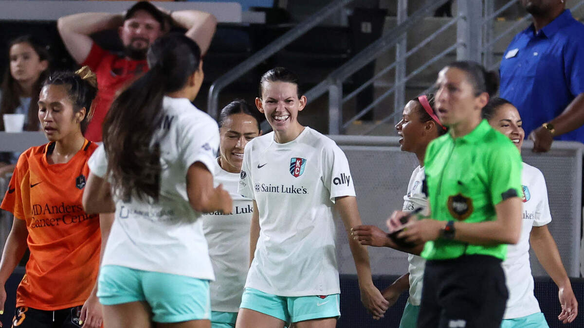 Kansas City Current forward Cece Kizer (center) smiles after scoring one of her two goals Wednesday night against the Houston Dash in Texas.