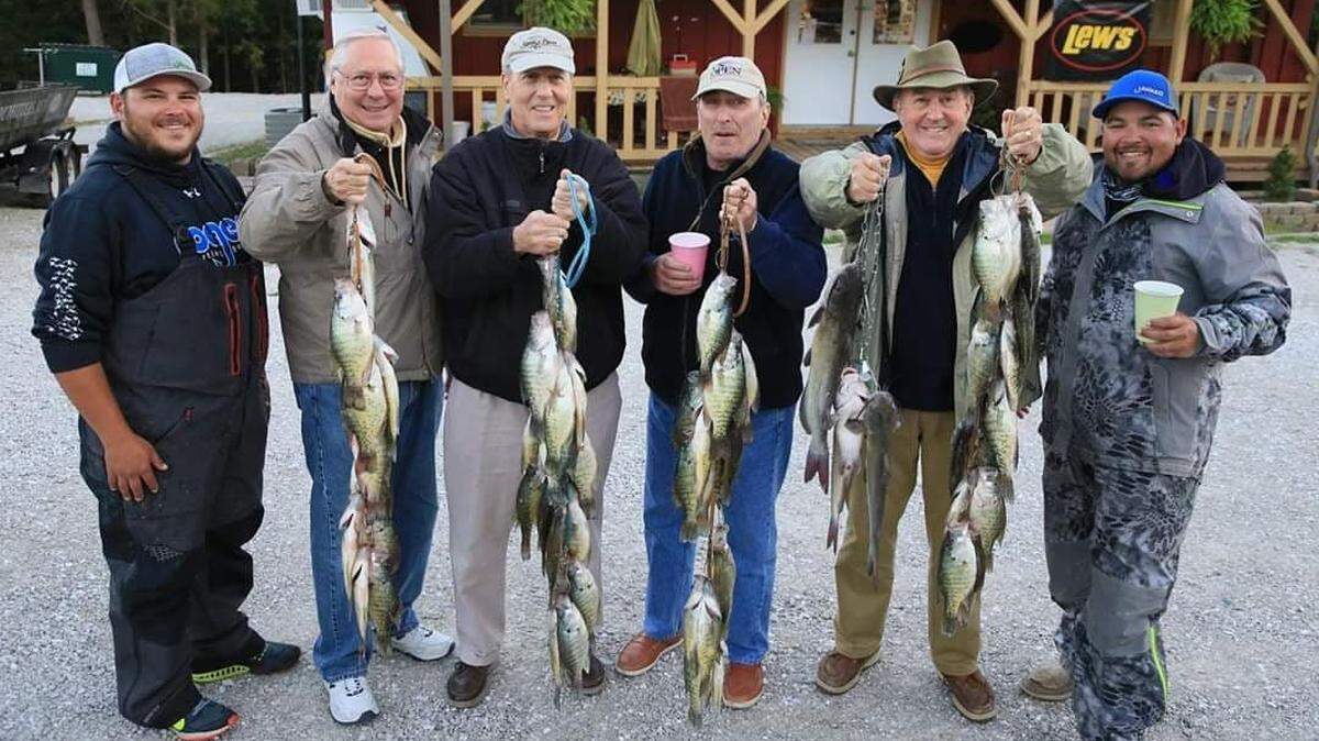 Kris Nelson (far right), owner of Tandem Fly Outfitters, and co-guide Cole Boyd (far left), took a group of lifelong friends fishing on Stockton Lake recently. They each left with plenty for a fish fry.