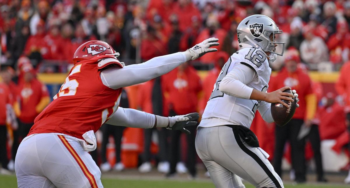 Kansas City Chiefs defensive tackle Chris Jones (95) dives for Las Vegas Raiders quarterback Aidan O’Connell (12) in the second quarter on Friday, Nov. 29, 2024, at GEHA Field at Arrowhead Stadium.