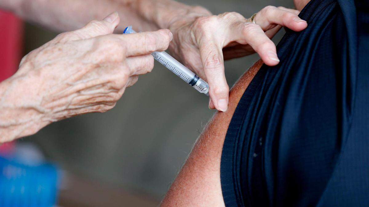 A man receives a COVID-19 vaccine in Springfield, Mo., on Tuesday, June 22, 2021.